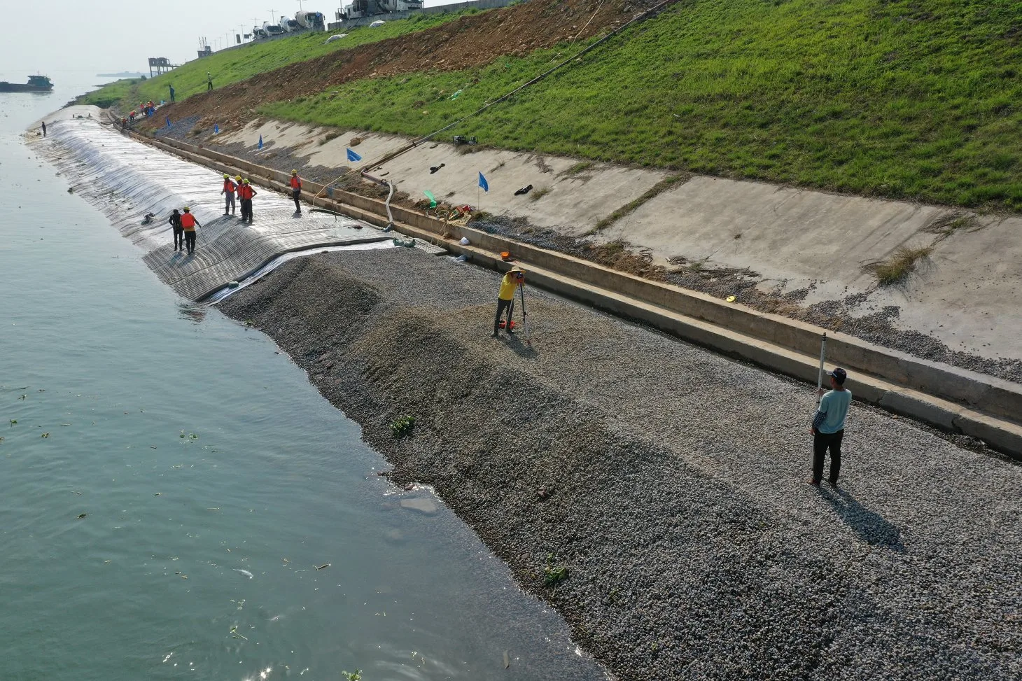Grouted mattress installation on coastal revetment slope showing filter point fabric type