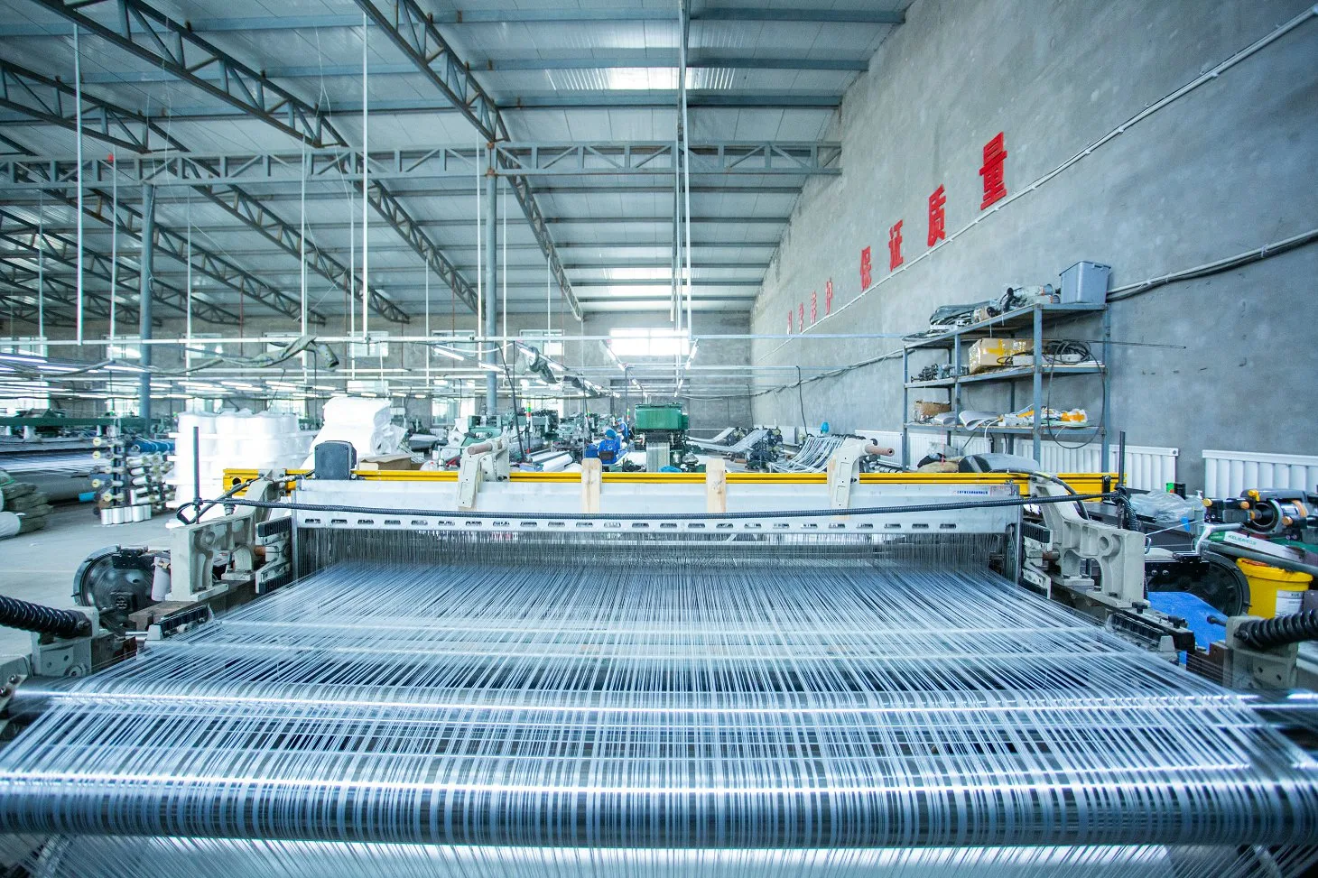 Close-up of loom weaving geotextile fabric