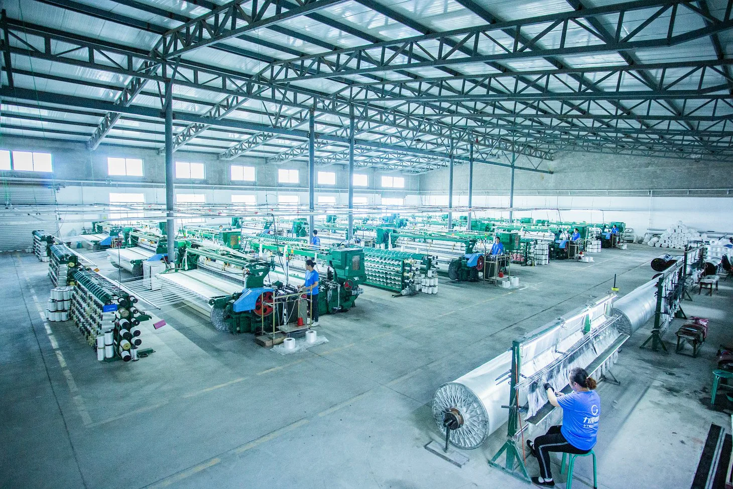 HydroBase factory production floor with 150+ weaving machines