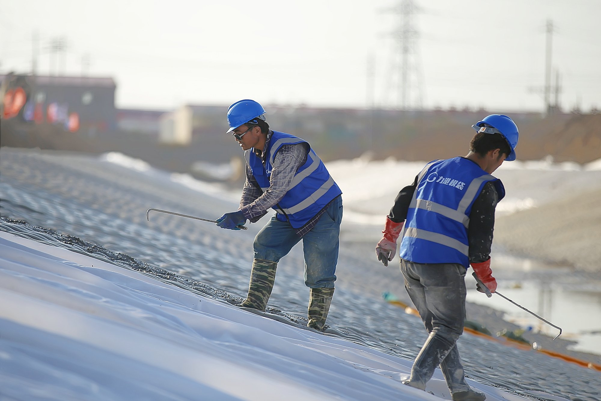 Installation crew working on slope grouting