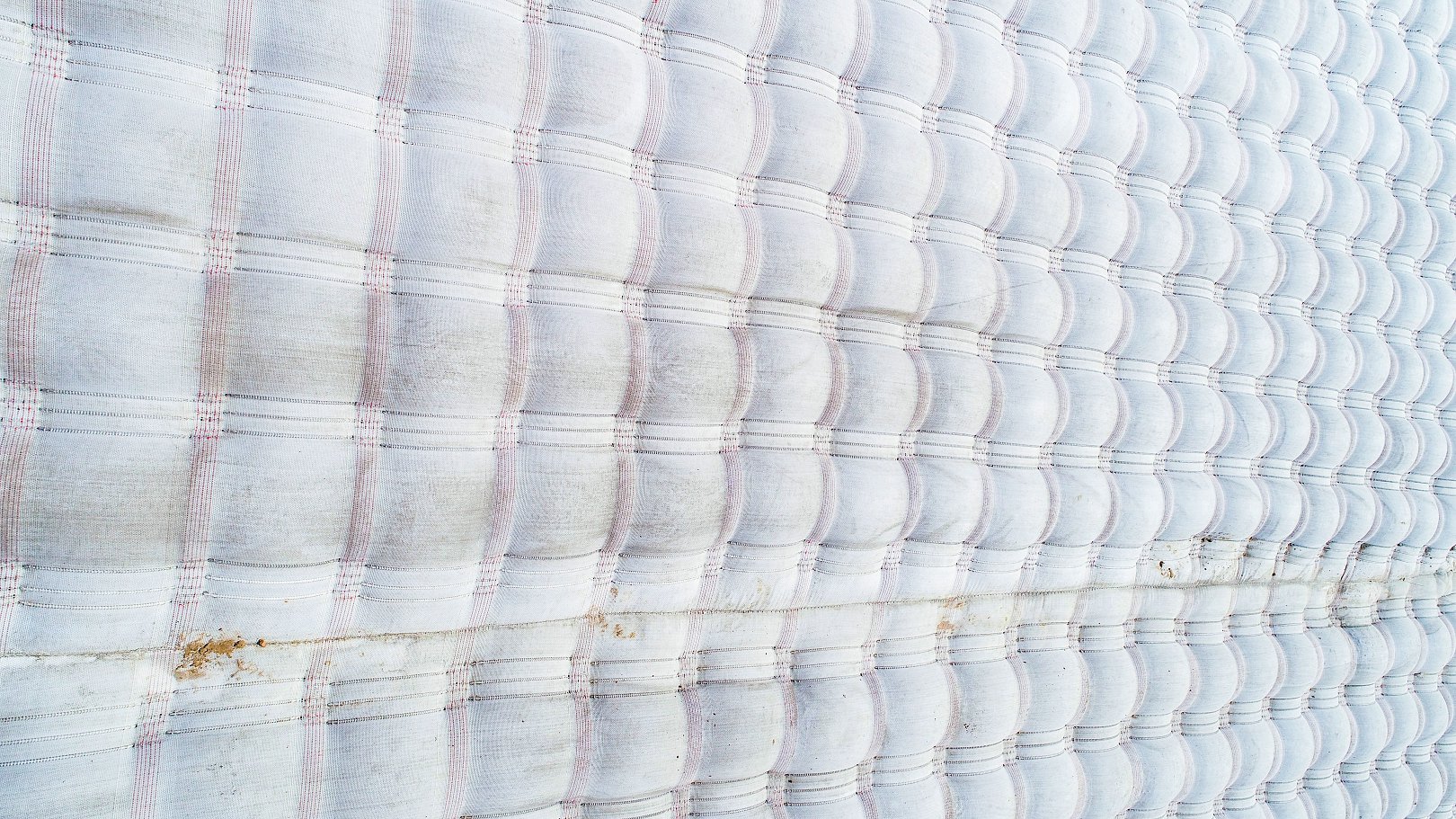 Aerial view of grouted mattress surface — uniform concrete armour requiring minimal long-term maintenance