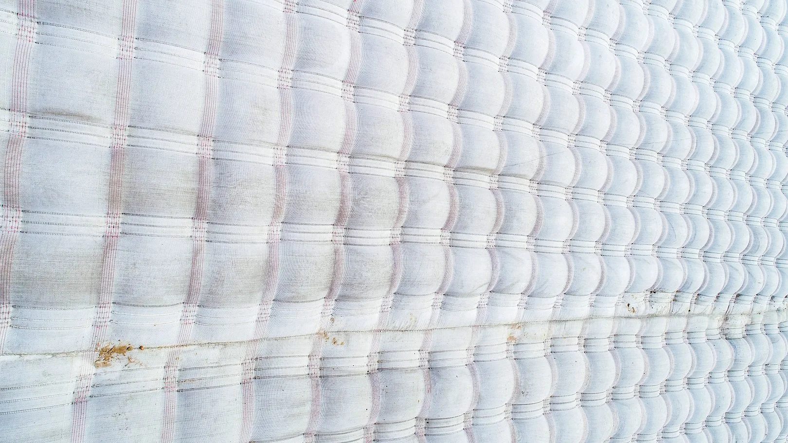 Aerial view of completed articulated concrete mattress installation showing uniform surface texture
